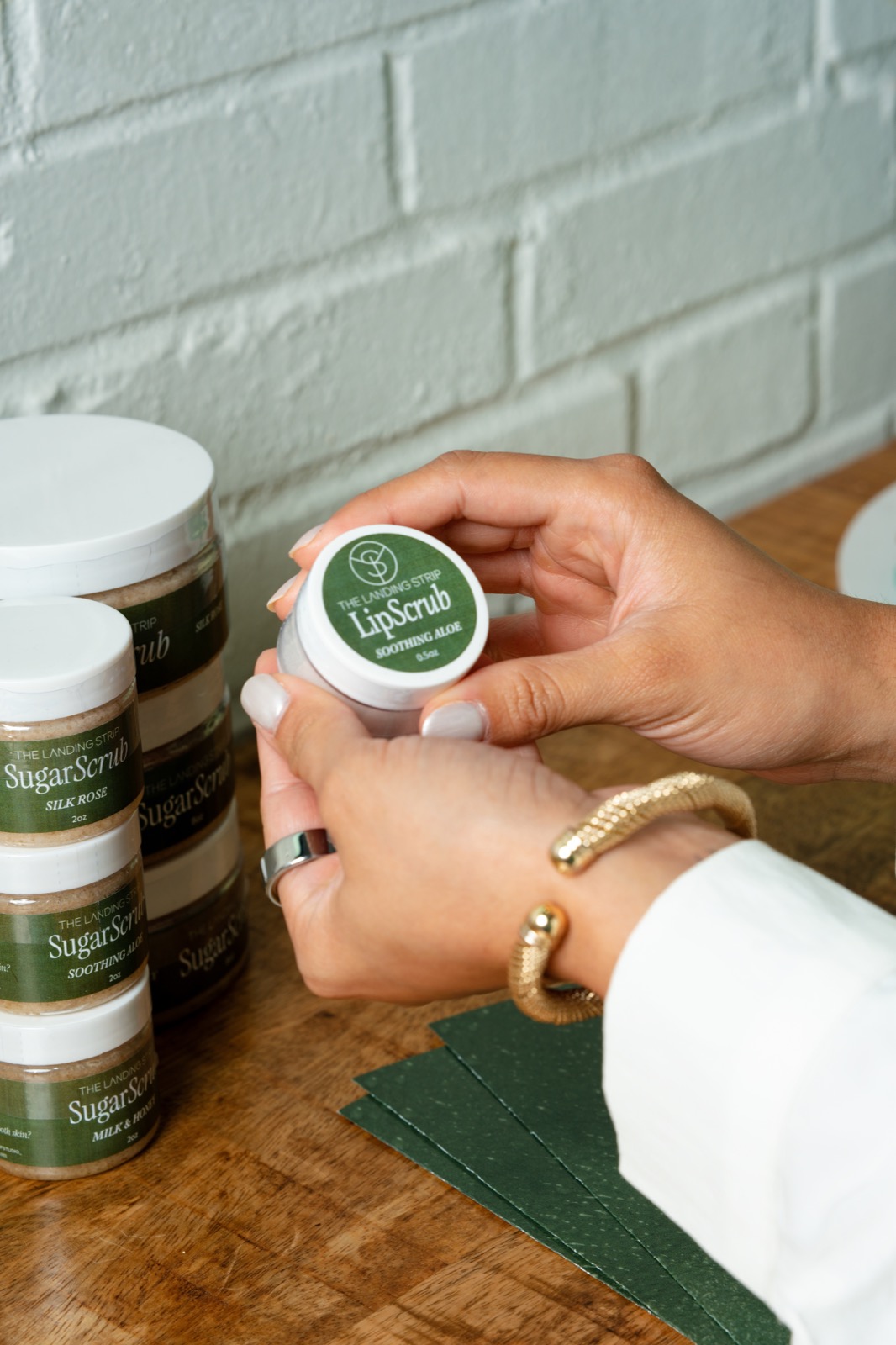The Landing Strip lip scrub and sugar scrub collection