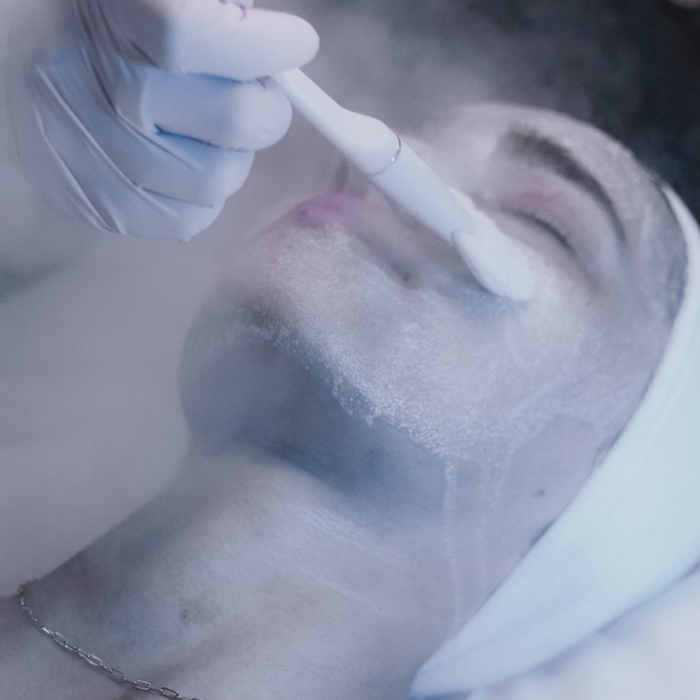 Facial treatment with a brush at The Landing Strip Studio
